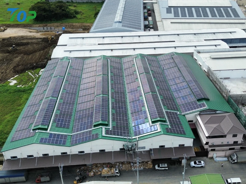Commercial solar racking system installed on an industrial factory metal roof in Manila.